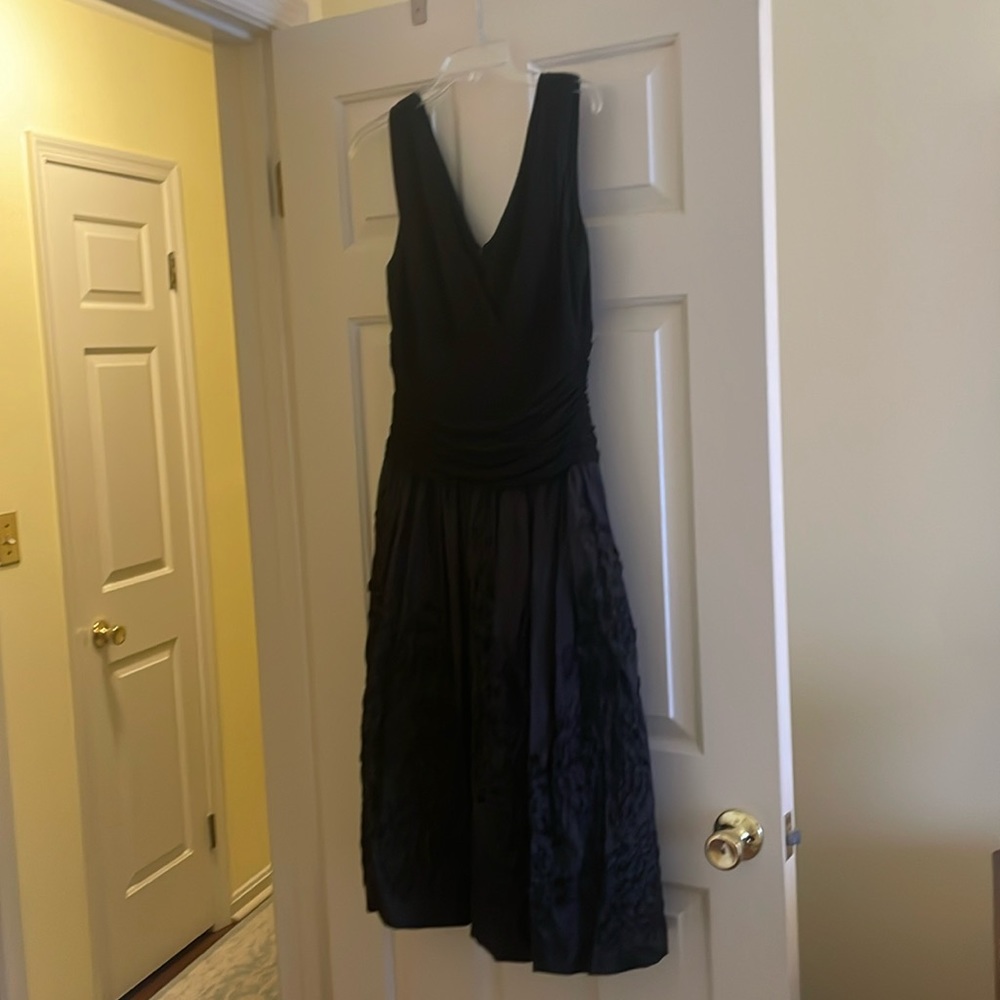Holiday or semi formal cocktail dress. Black in color. Only worn once.